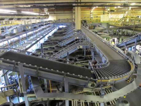 Multi-level conveyor system for transporting tires