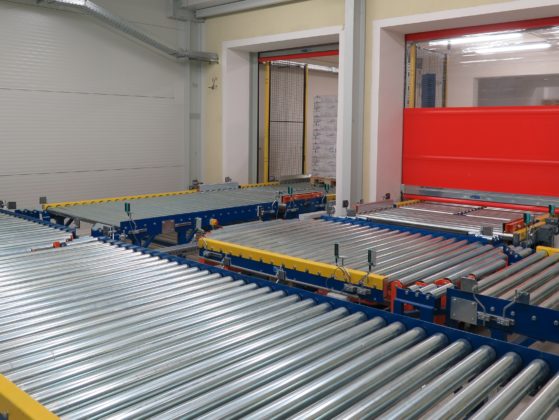 Conveyor System for Transporting Pallets Between the First and the Second Floor